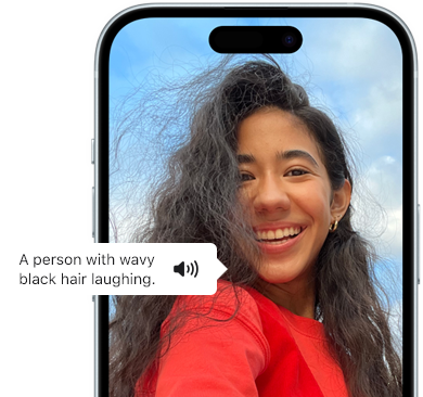 iPhone 15 showing Voiceover feature announcing the picture information, A person with wavy black hair laughing